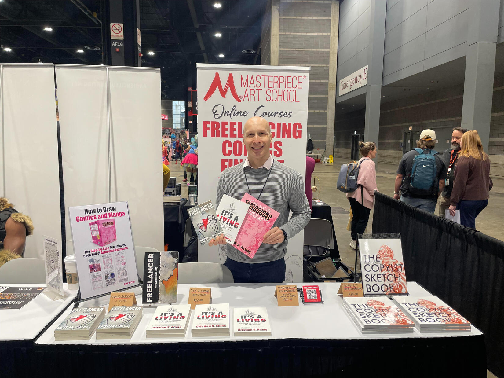 Cristian S. Aluas with books
